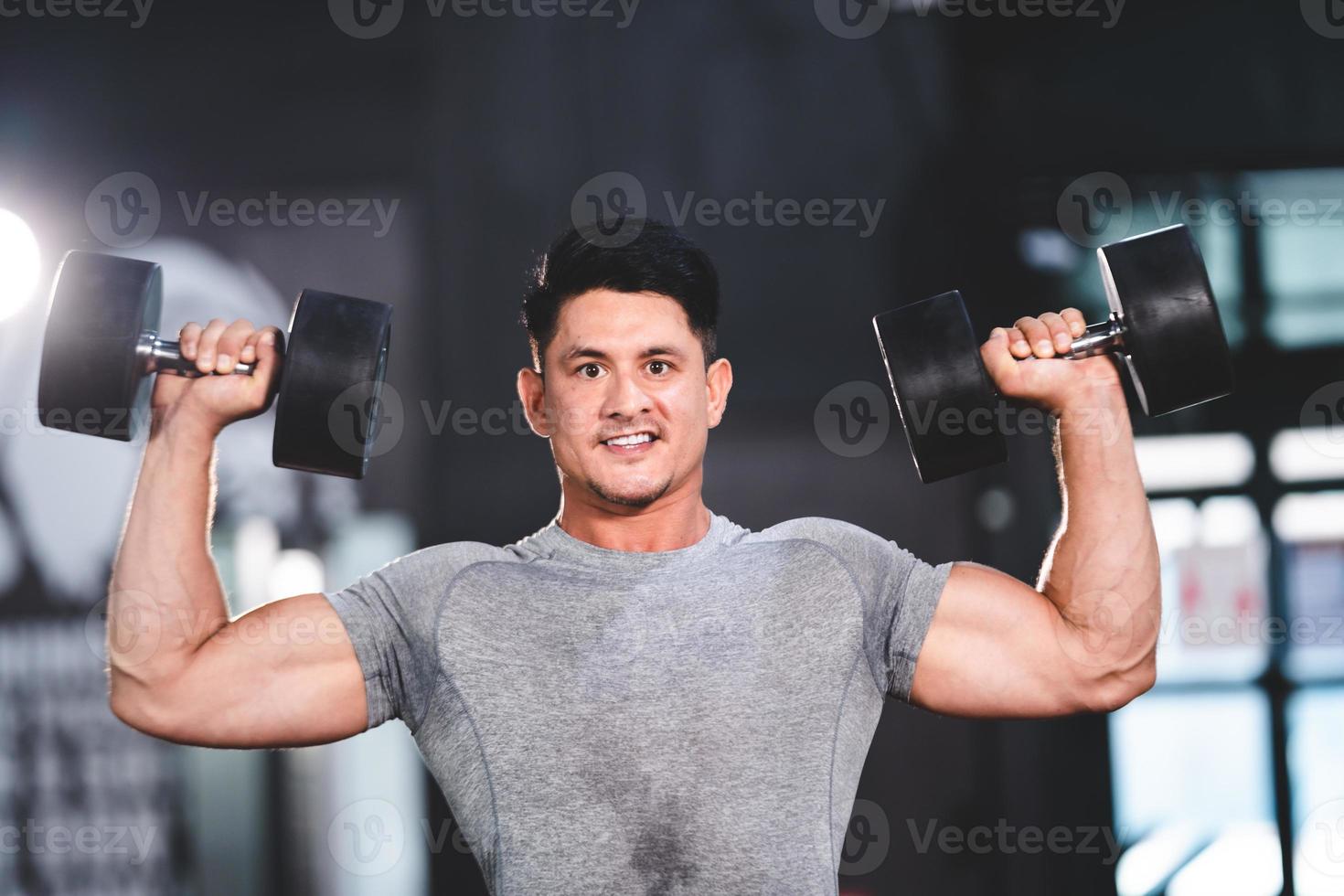 strong athlete man person exercising in the sport gym, workout exercise training in fitness for body strong and fit, bodybuilding training and healthy people lifestyle concept photo