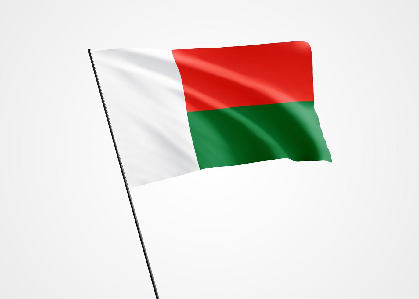 bandera de madagascar ondeando alto en el fondo blanco aislado. 26 de junio día de la independencia de madagascar colección de banderas nacionales mundiales. ilustración 3d de la bandera de la nación foto