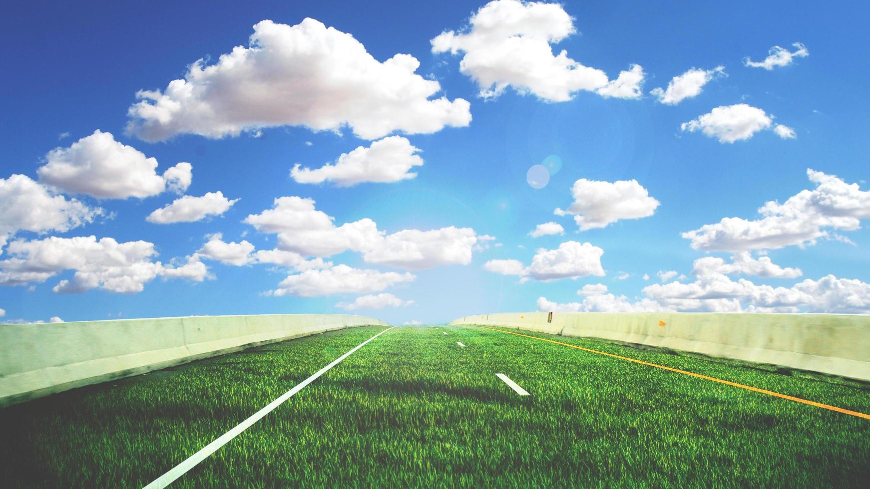Green road concept without pollution. The road is made of grass on a bright day. photo