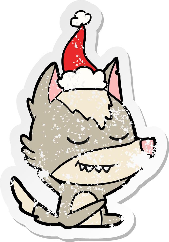 friendly distressed sticker cartoon of a wolf sitting wearing santa hat vector