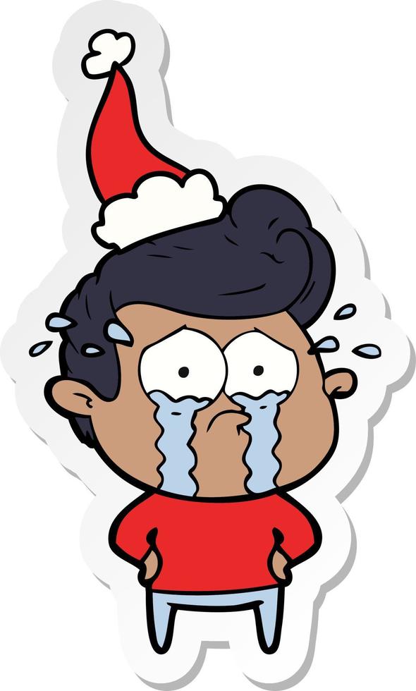 sticker cartoon of a crying man wearing santa hat vector