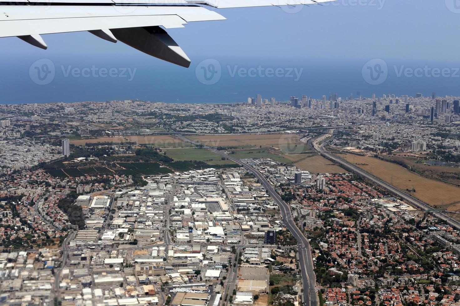 The earth is visible through the window of an airplane photo