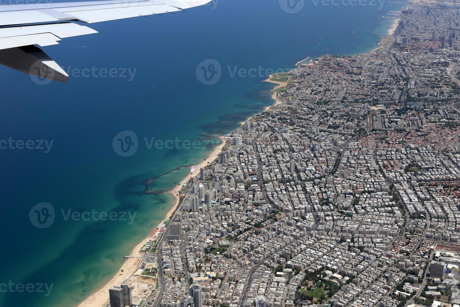 The earth is visible through the window of an airplane photo