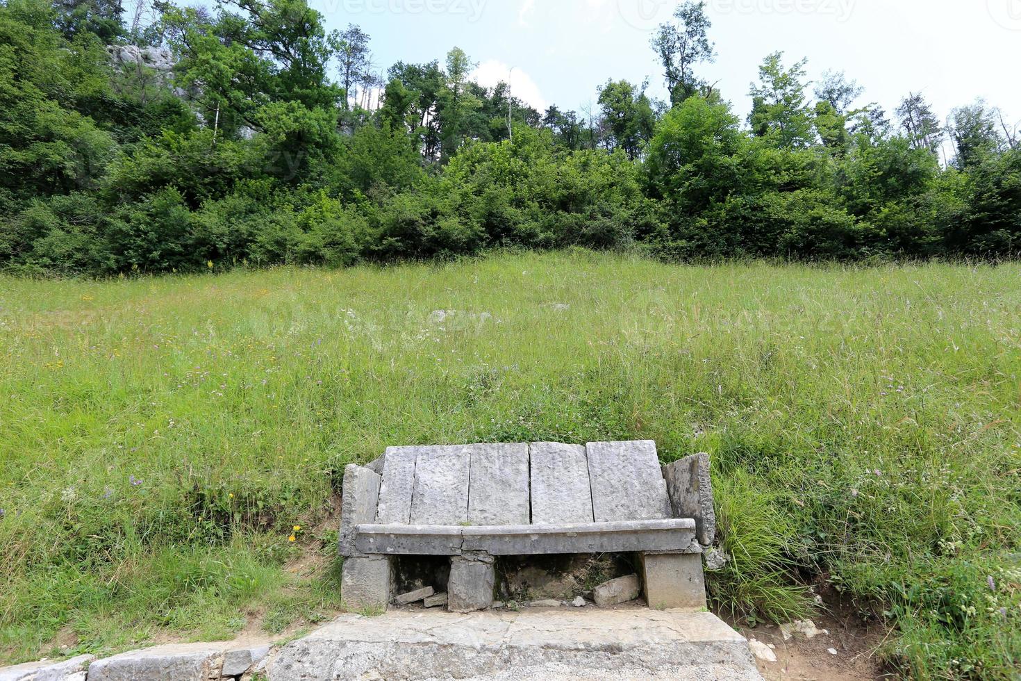 Bench for rest in a city park on the shores of the Mediterranean Sea. photo