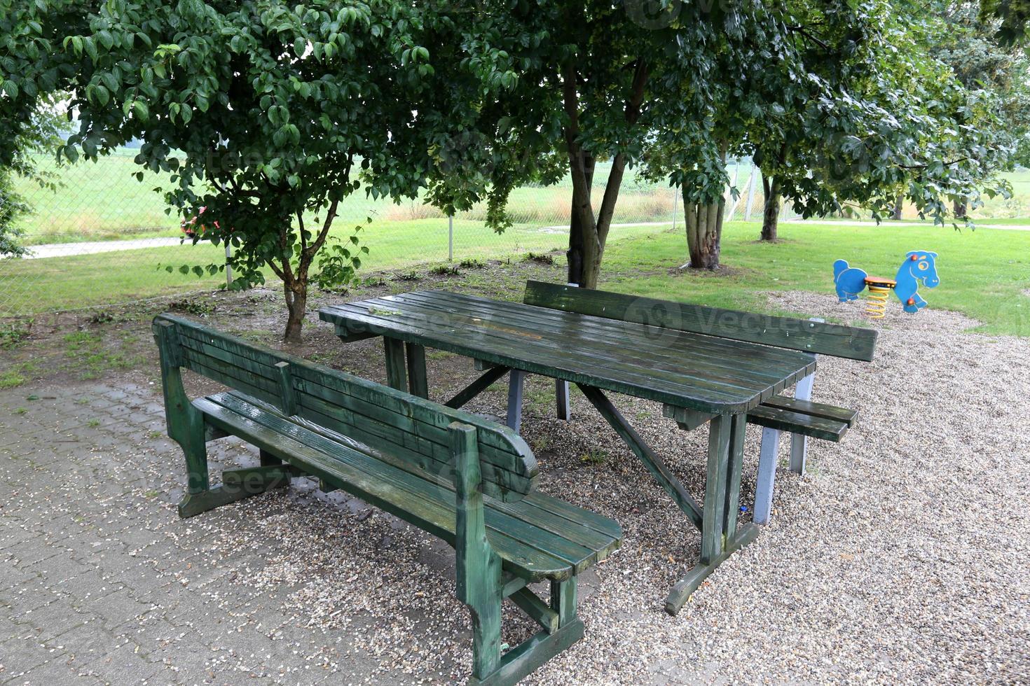 Bench for rest in a city park on the shores of the Mediterranean Sea. photo