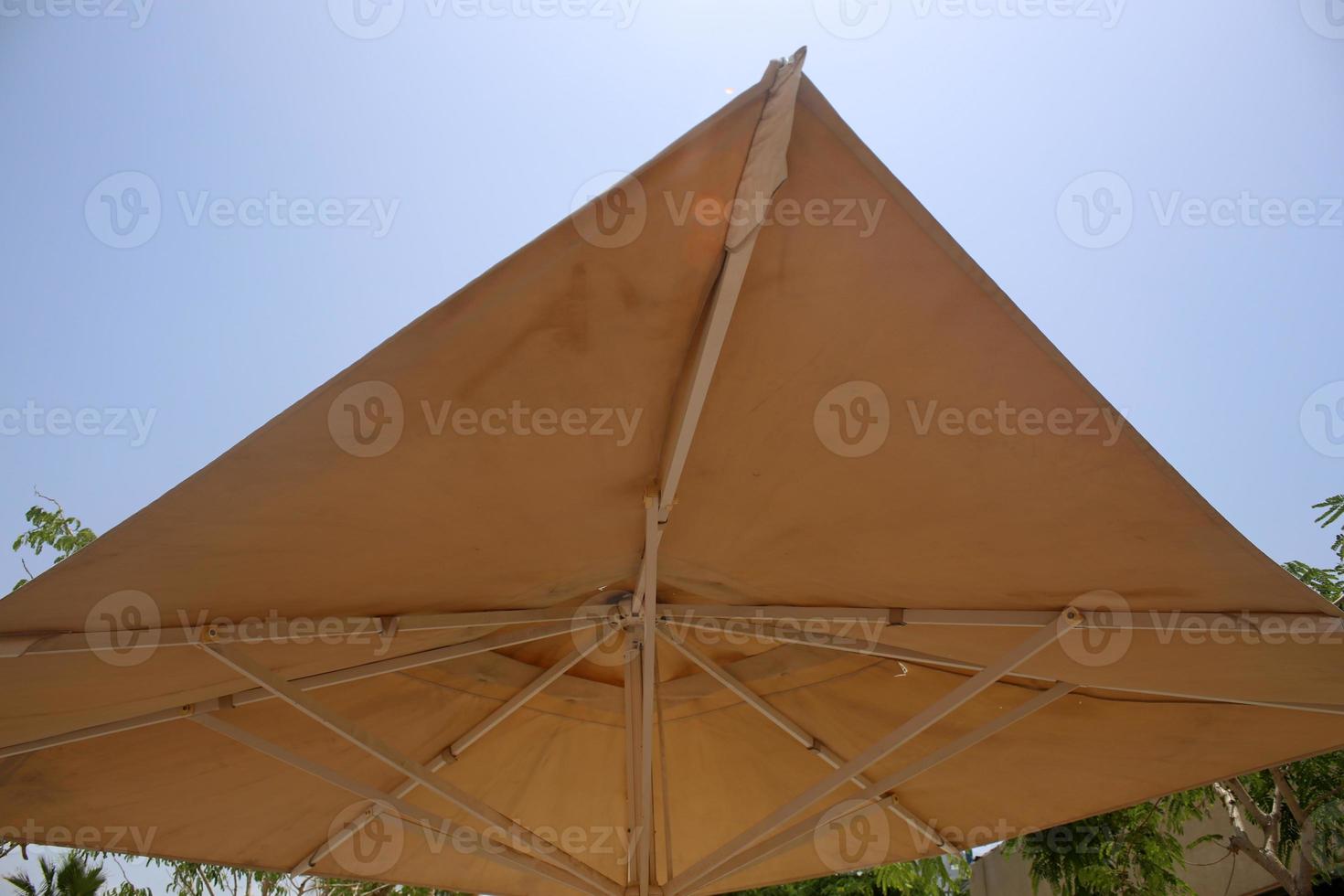 Umbrella to protect the sun in a city park in Israel photo