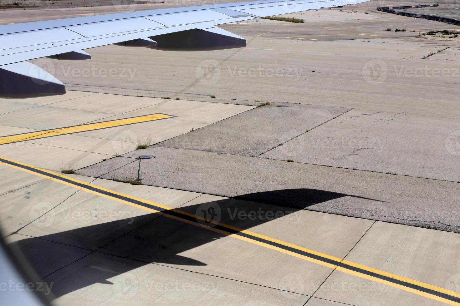 The earth is visible through the window of an airplane photo