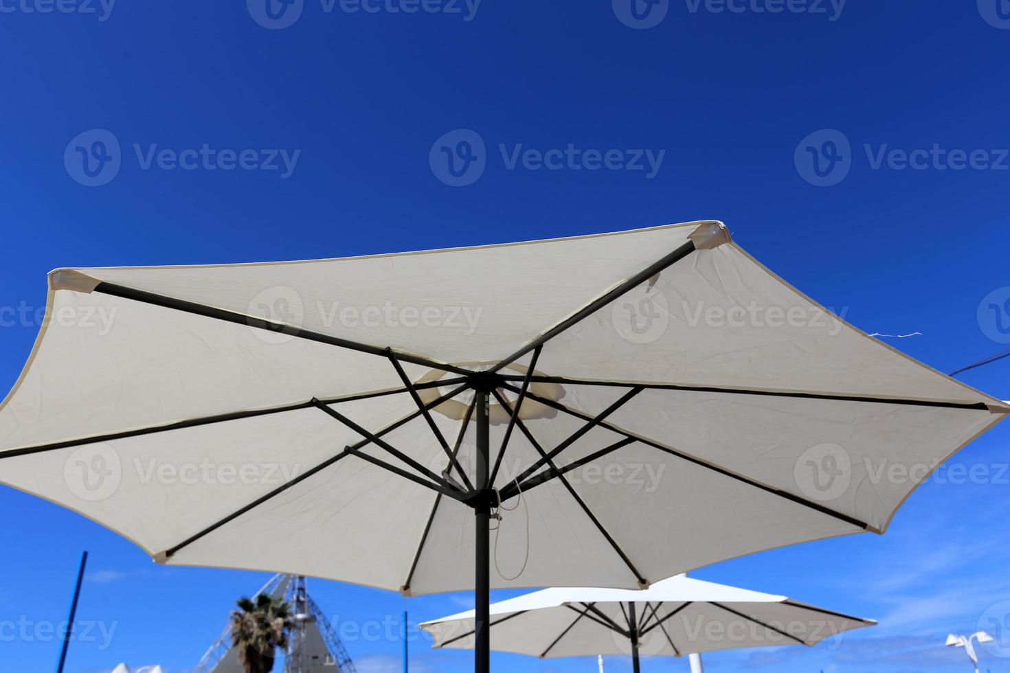 Umbrella to protect the sun in a city park in Israel photo