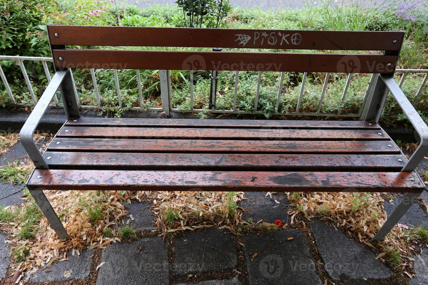 Bench for rest in a city park on the shores of the Mediterranean Sea. photo