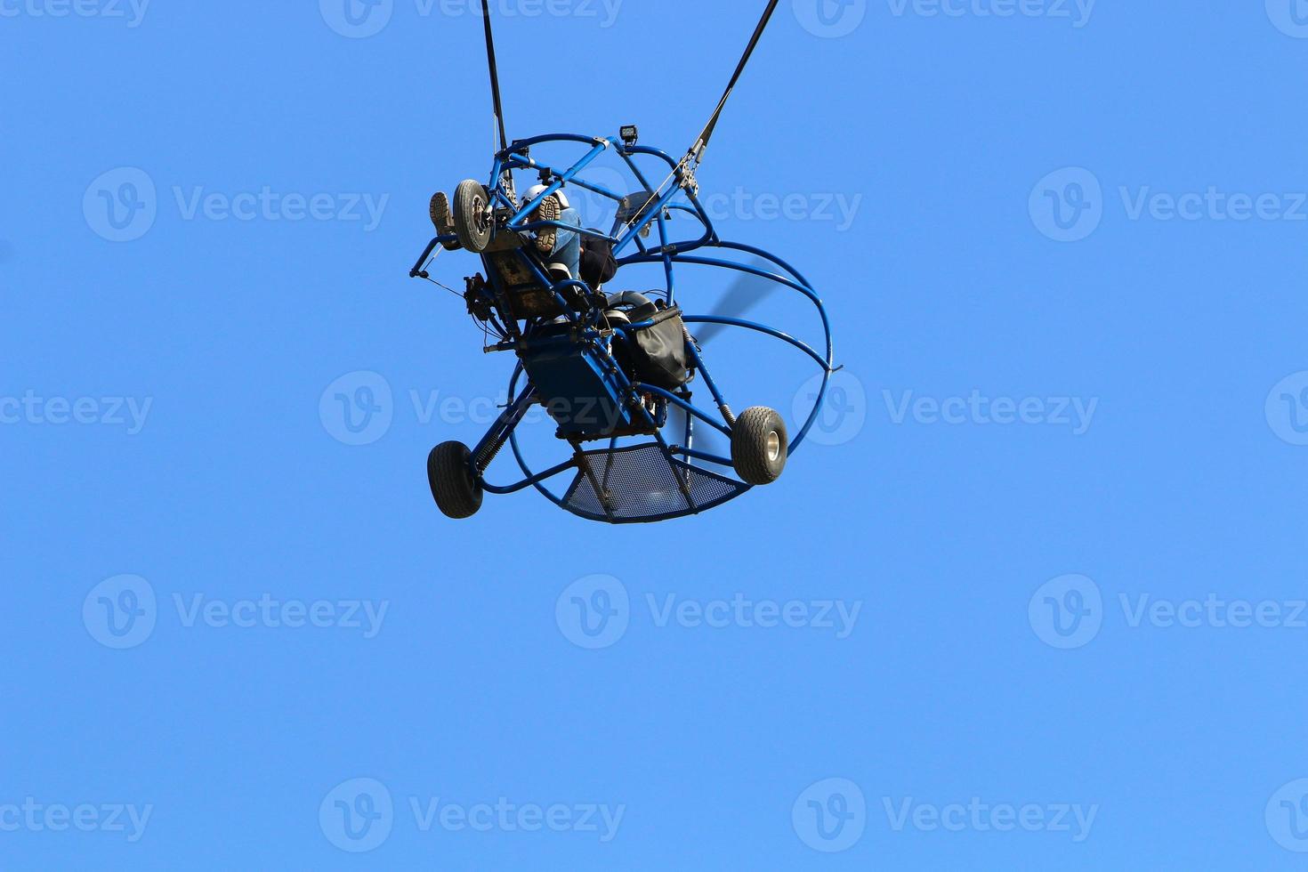 A paraglider flies over the Mediterranean Sea in northern Israel photo