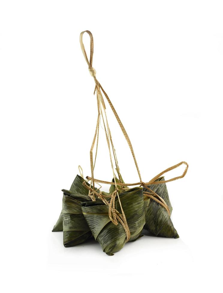Group of delicious zongzi on white background photo