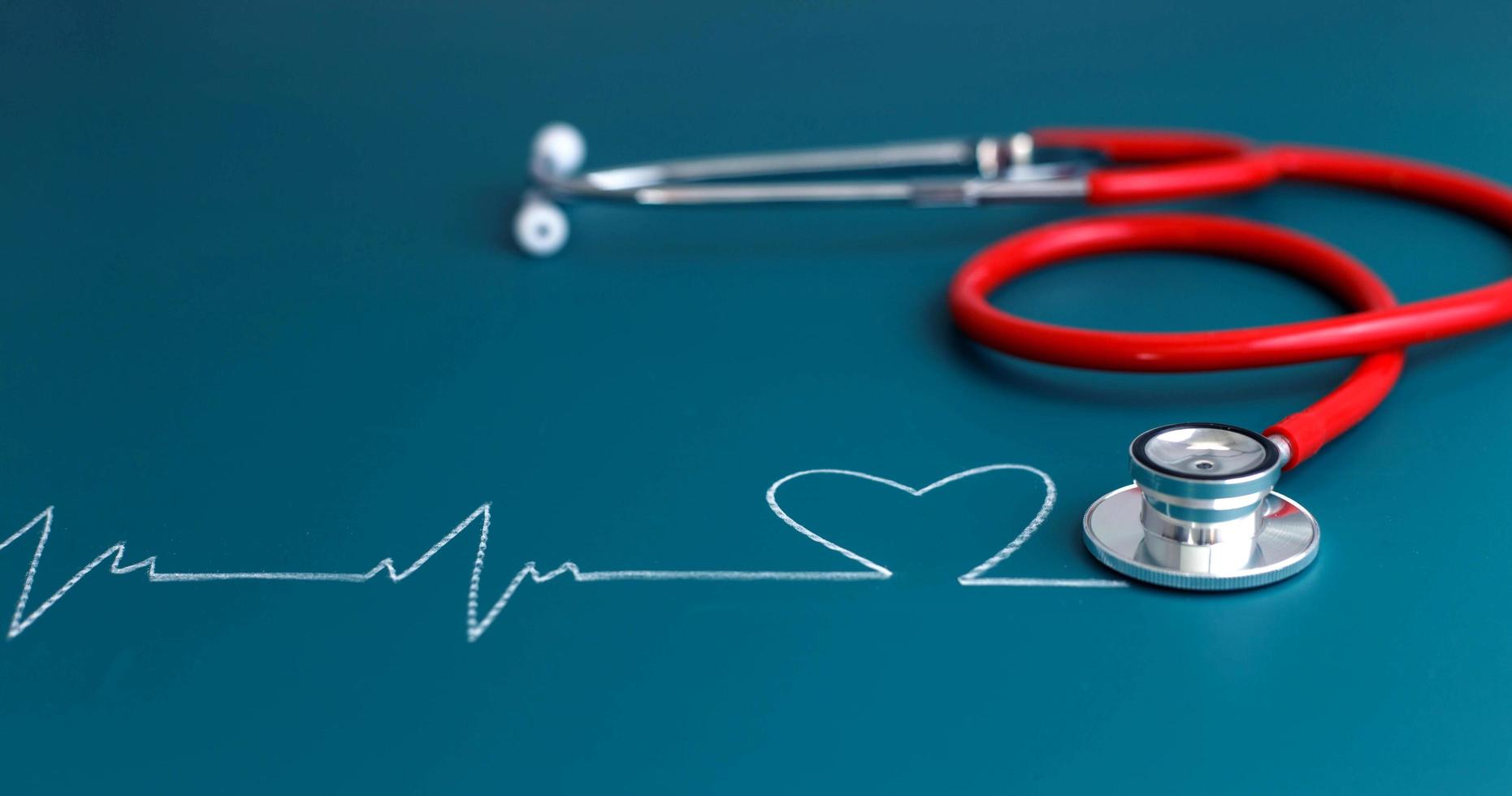 Close up of stethoscope and heartbeat photo