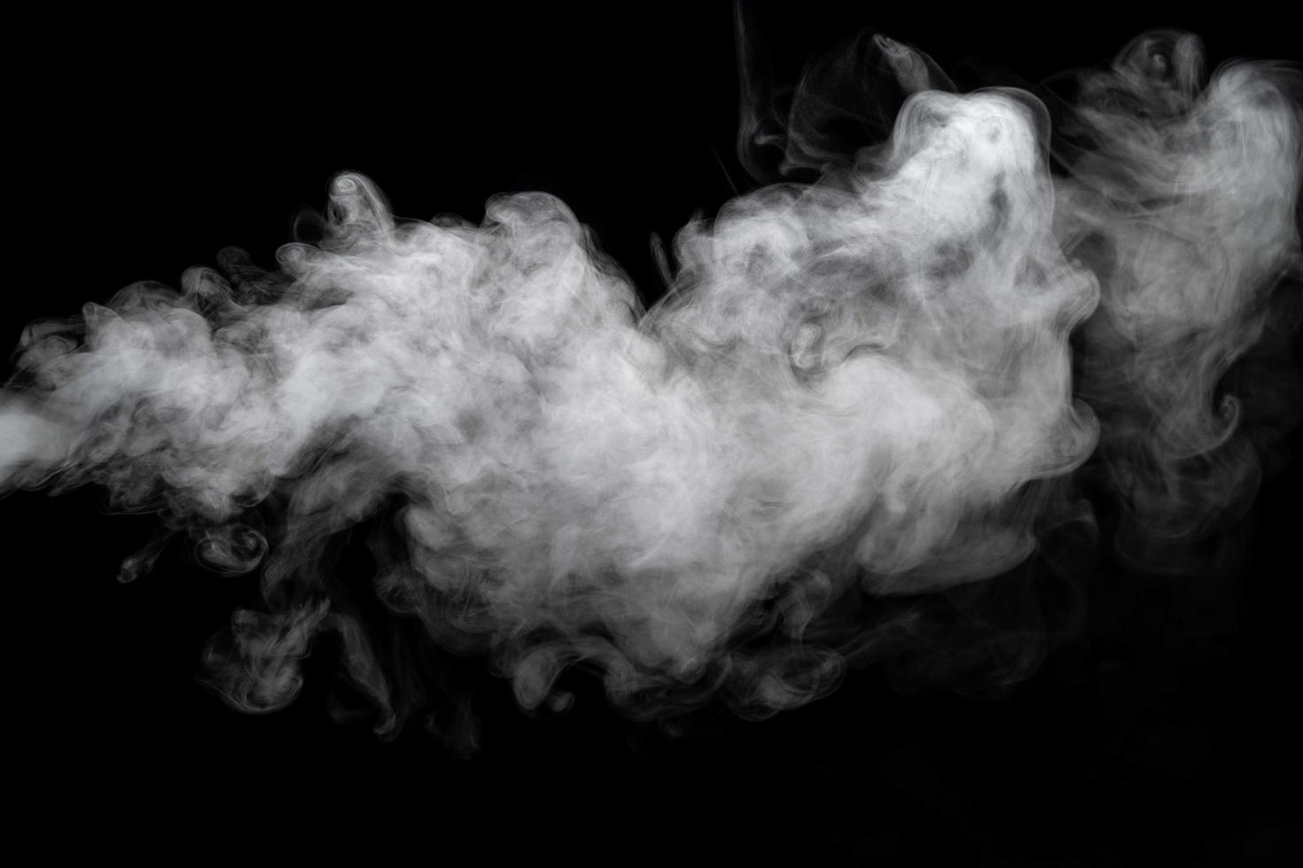 Abstract powder or smoke isolated on black background photo