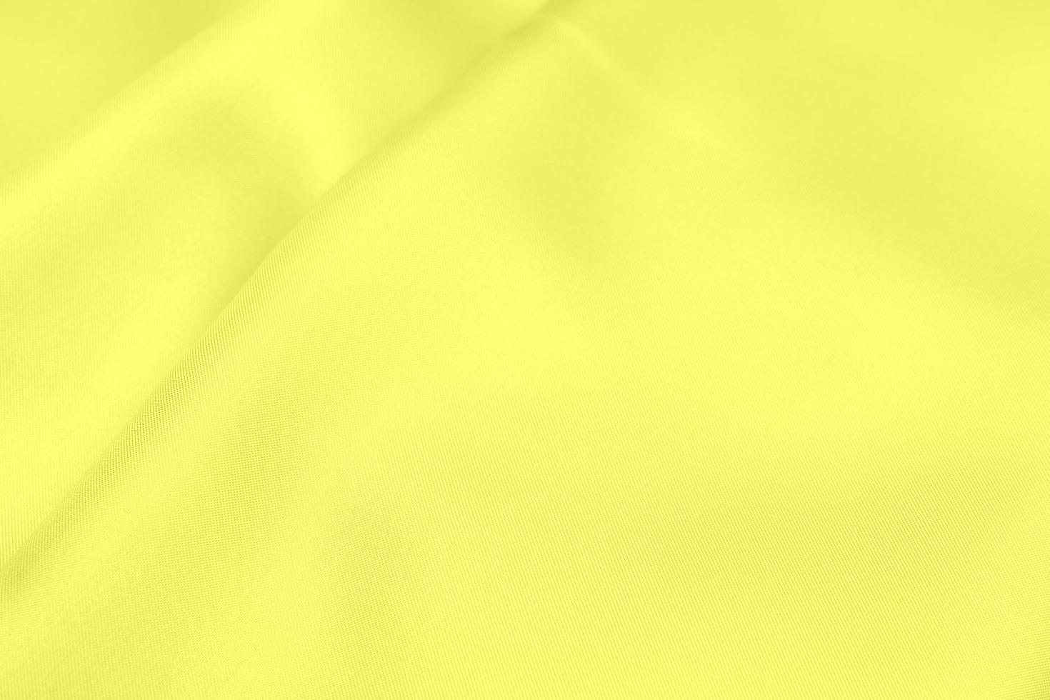 Yellow satin fabric texture soft blur background photo