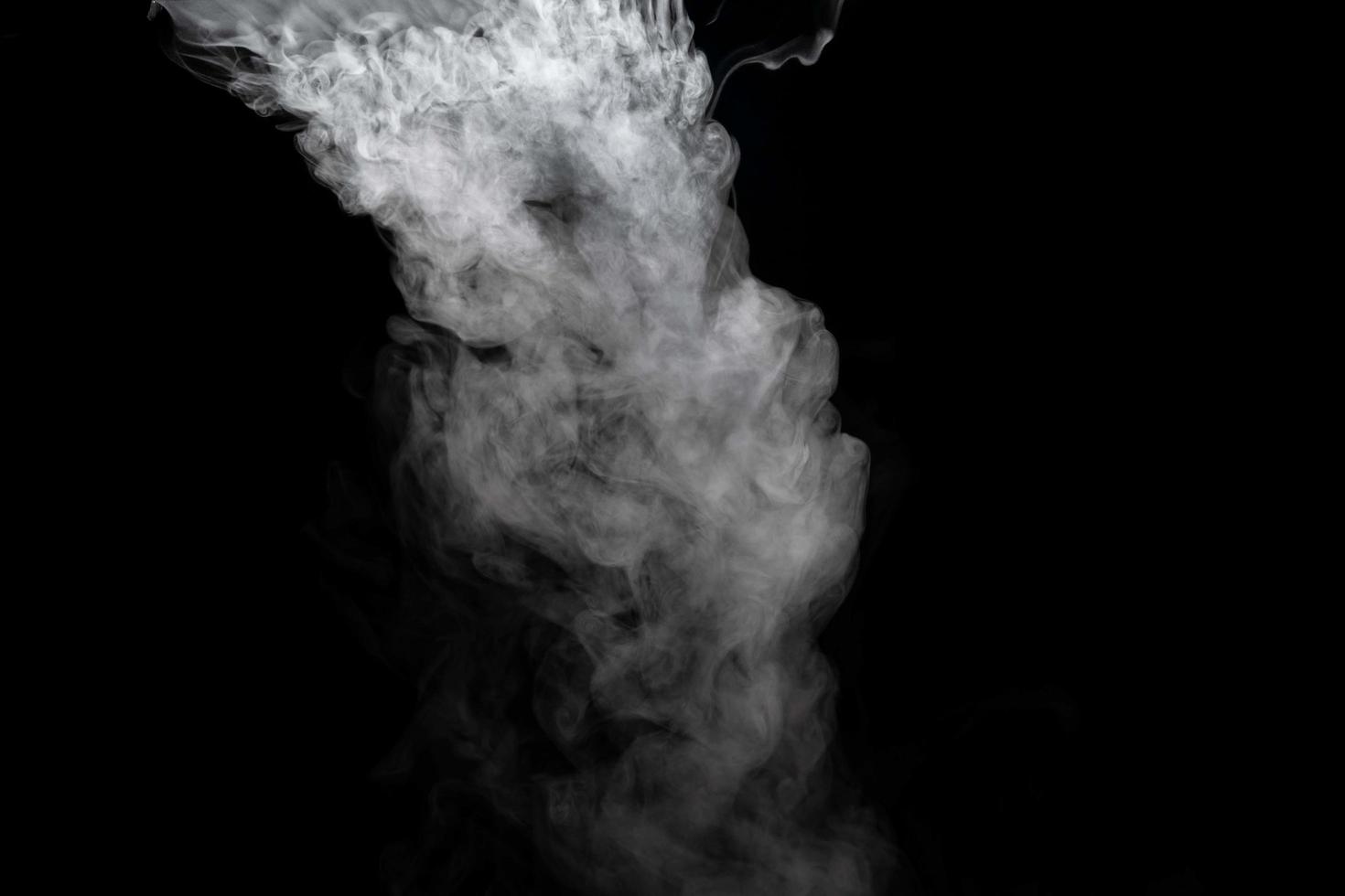 Abstract powder or smoke isolated on black background photo