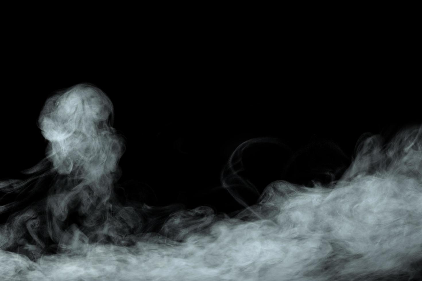 Abstract powder or smoke isolated on black background photo