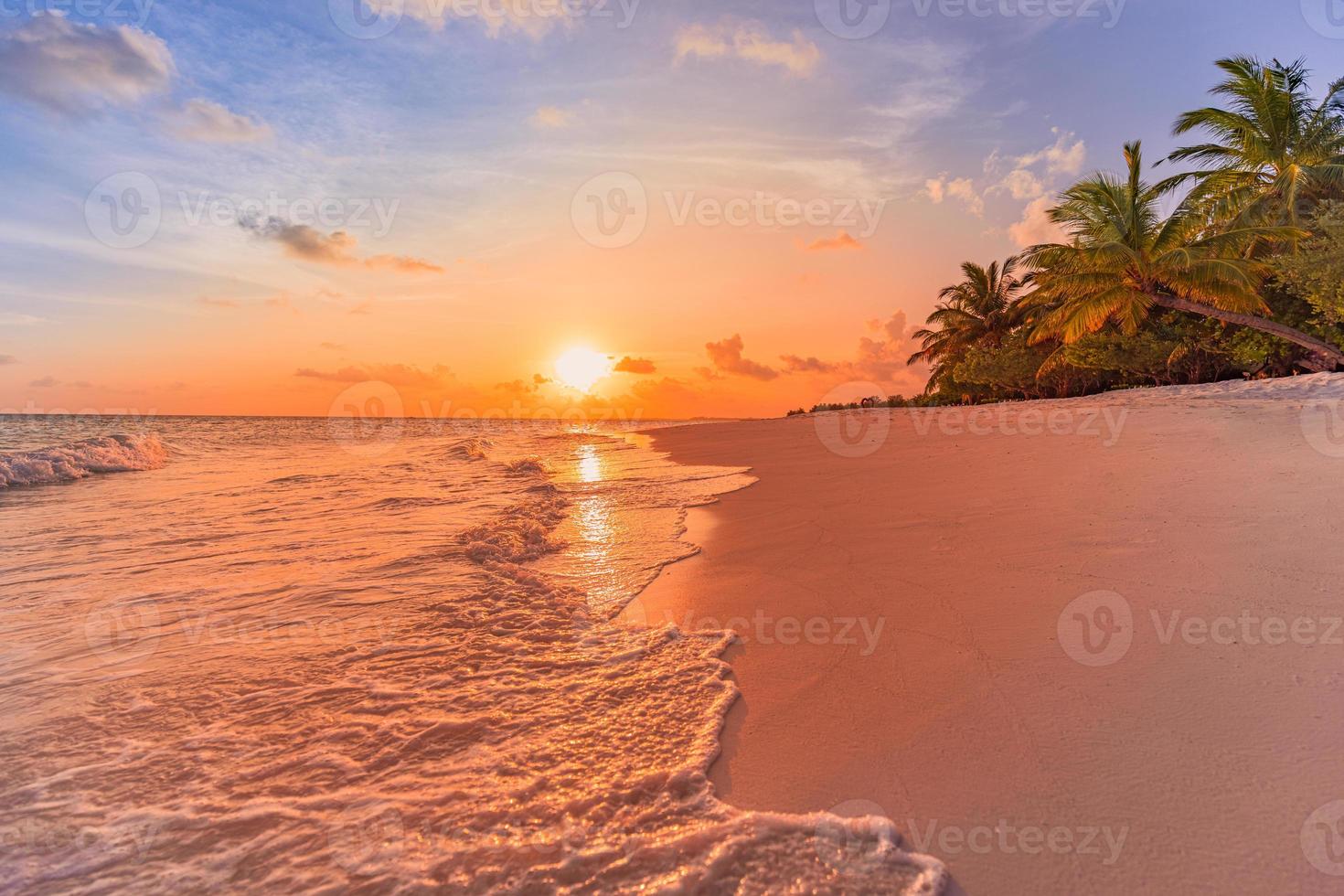 Fantastic closeup view of calm sea water waves with orange sunrise sunset sunlight. Tropical island beach landscape, exotic shore coast. Summer vacation, holiday amazing nature scenic. Relax paradise photo