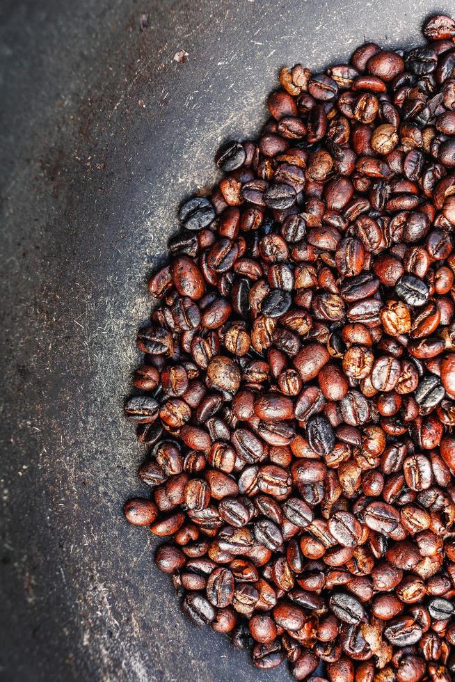 freshly roasted coffee beans background and texture roasted coffee beans photo