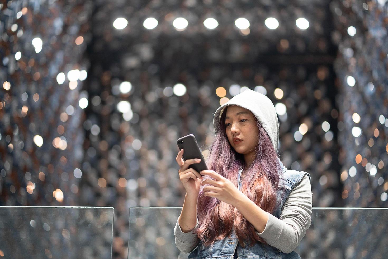 Young woman using cellphone photo