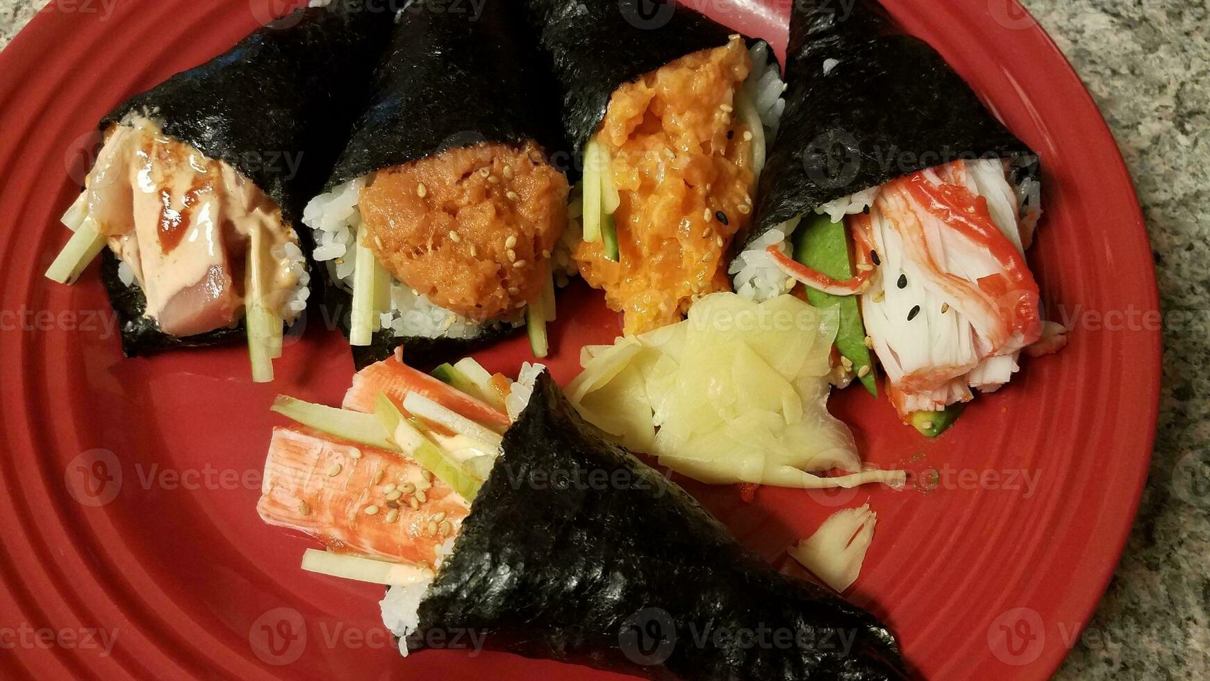 crab and tuna seafood sushi Japanese handrolls on plate photo