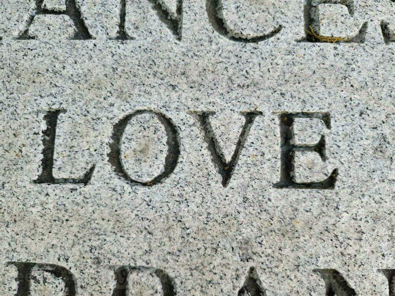 the word love engraved or etched on marble photo