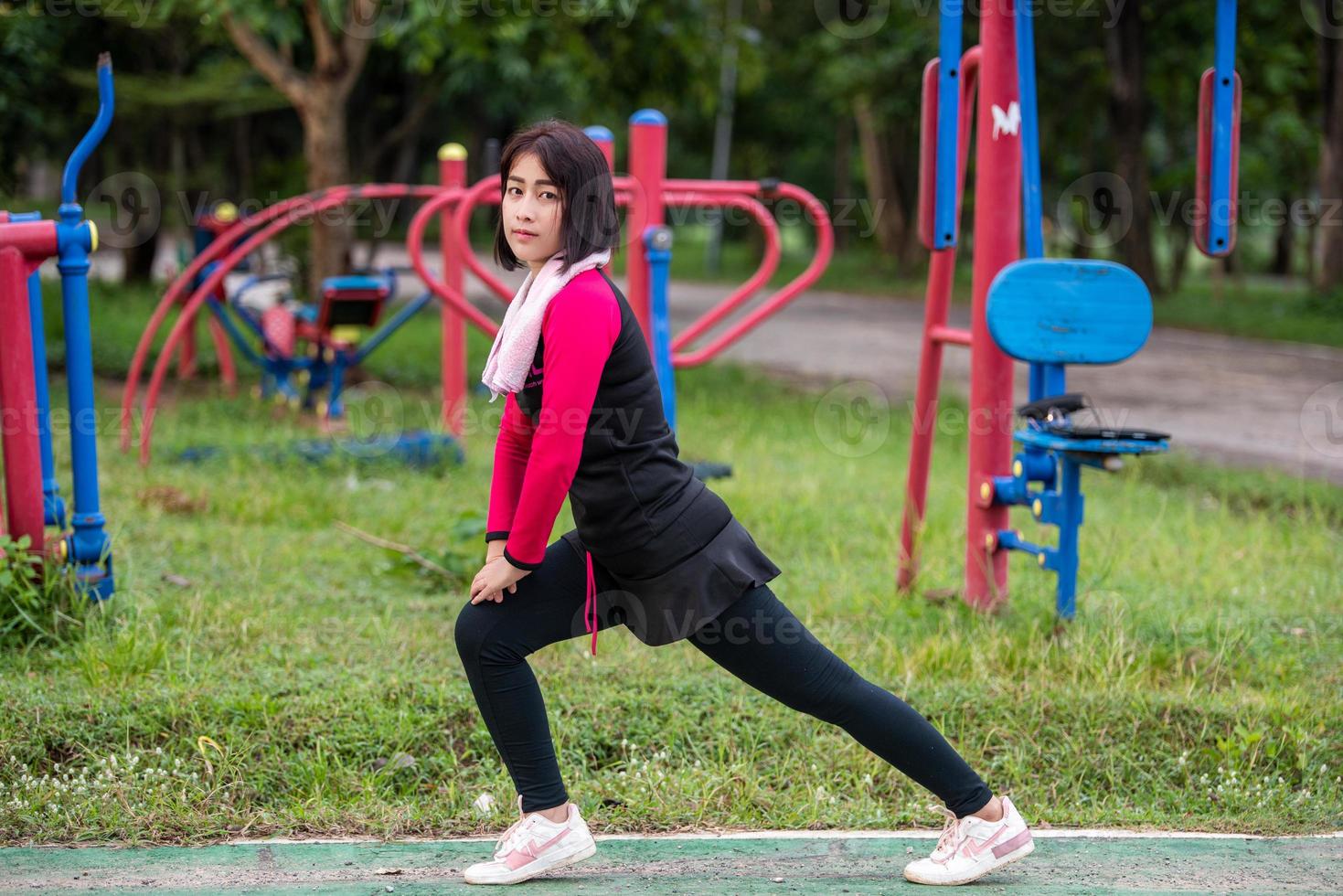 Young woman stretching muscle photo