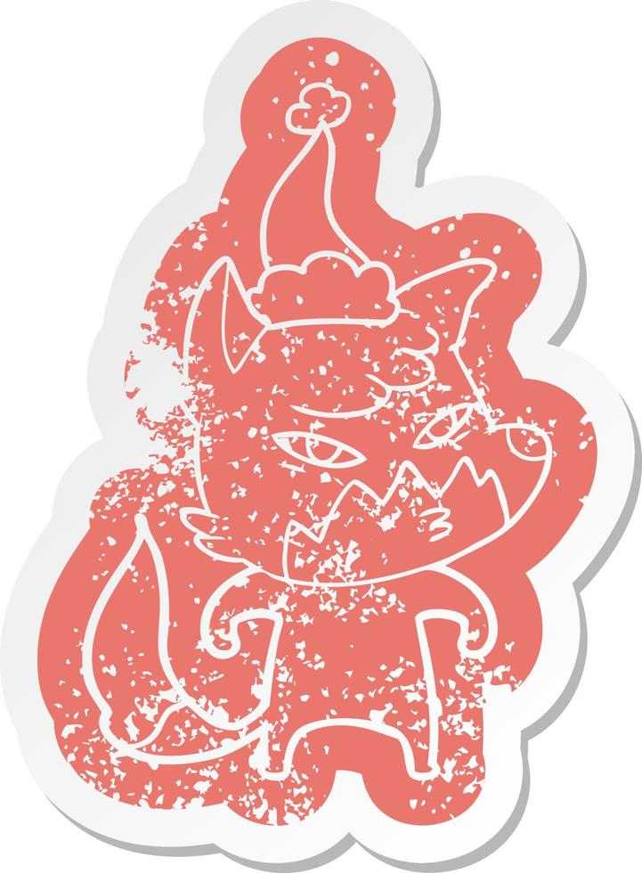 clever cartoon distressed sticker of a fox wearing santa hat vector