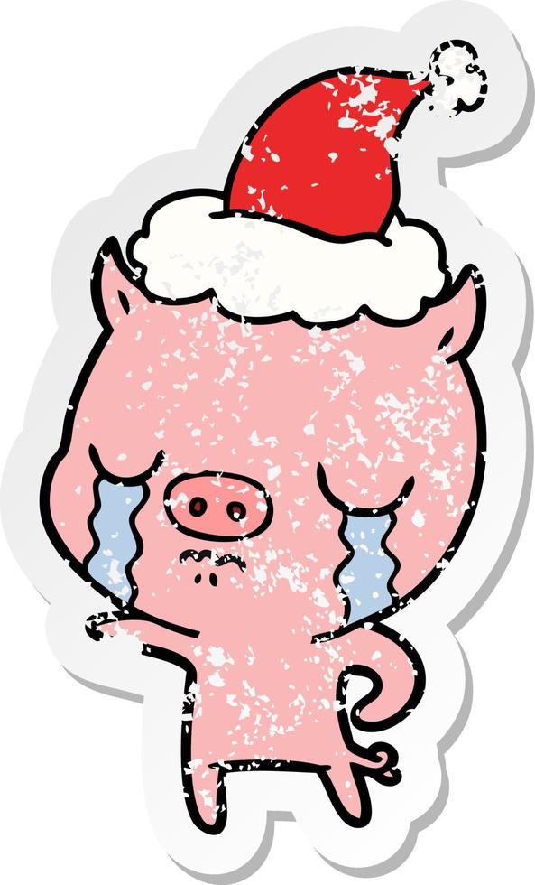 distressed sticker cartoon of a pig crying wearing santa hat vector