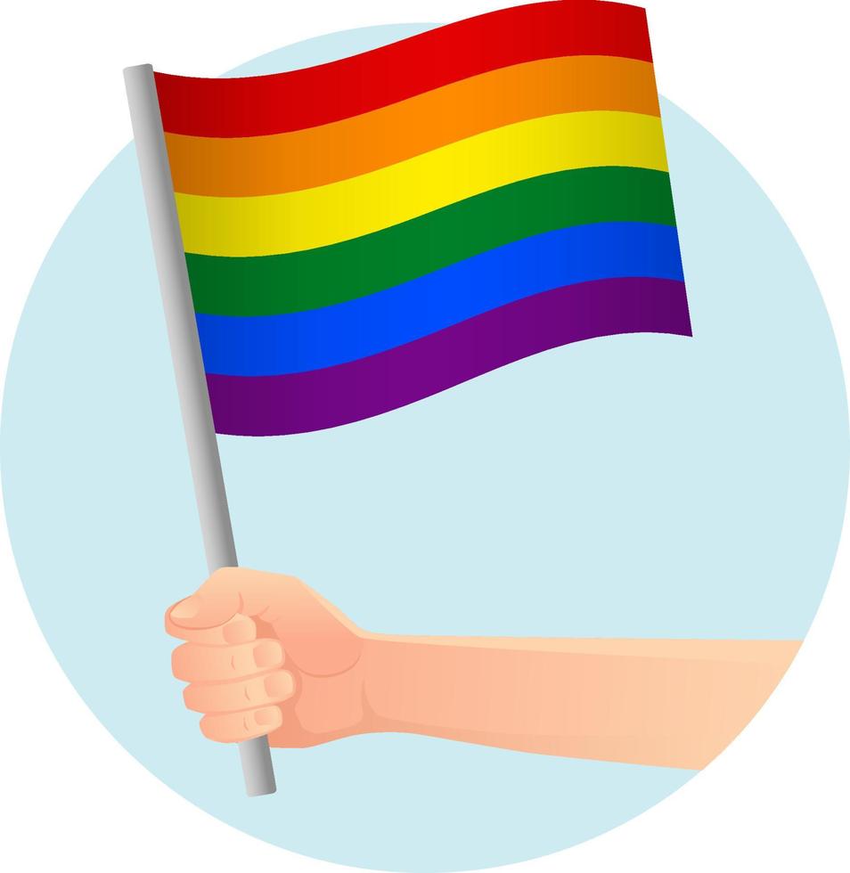 bandera lgbt en la mano vector