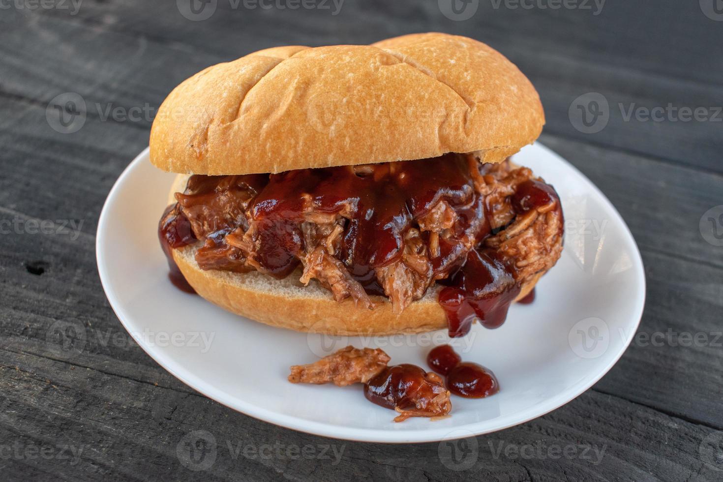 barbecue pork sandwich on plate photo