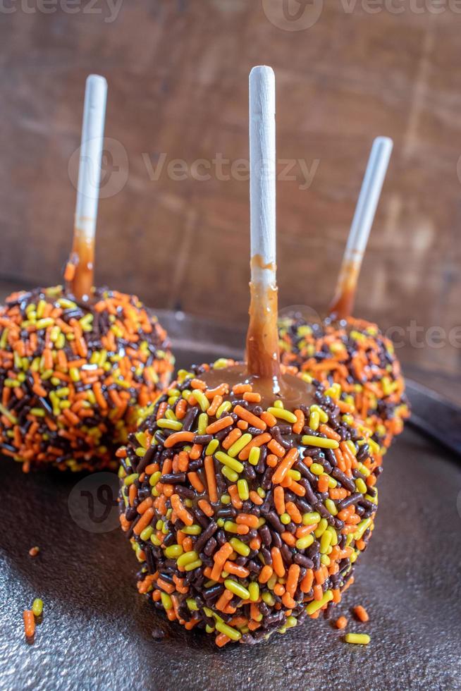 Fall colored candy caramel apples photo