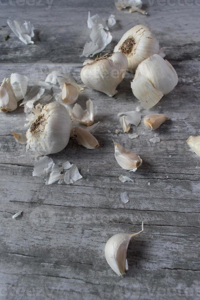 garlic bulbs on rustic wood top view photo