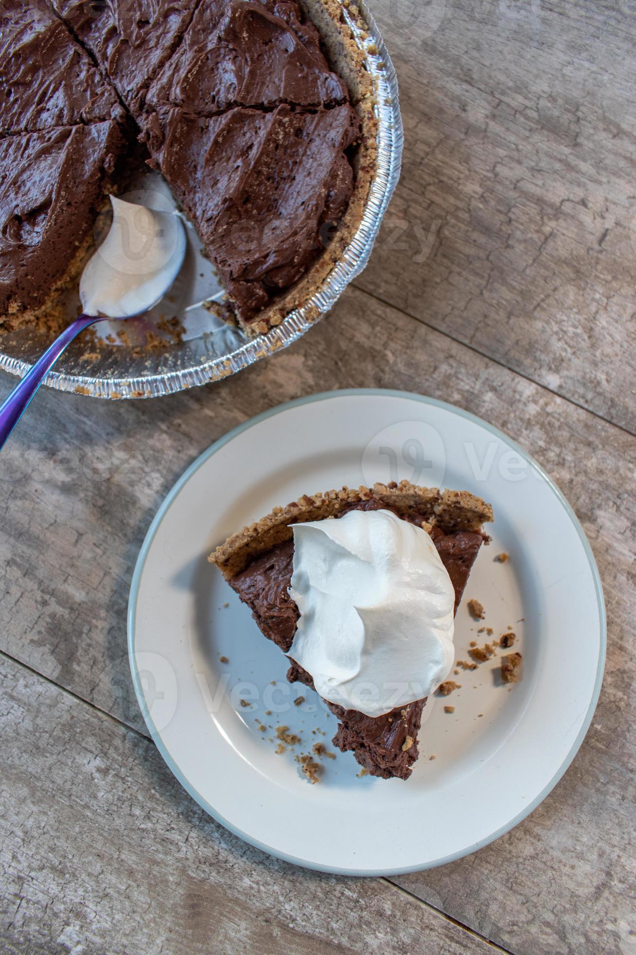 top view of chocolate pudding pie slice with whipped cream topping