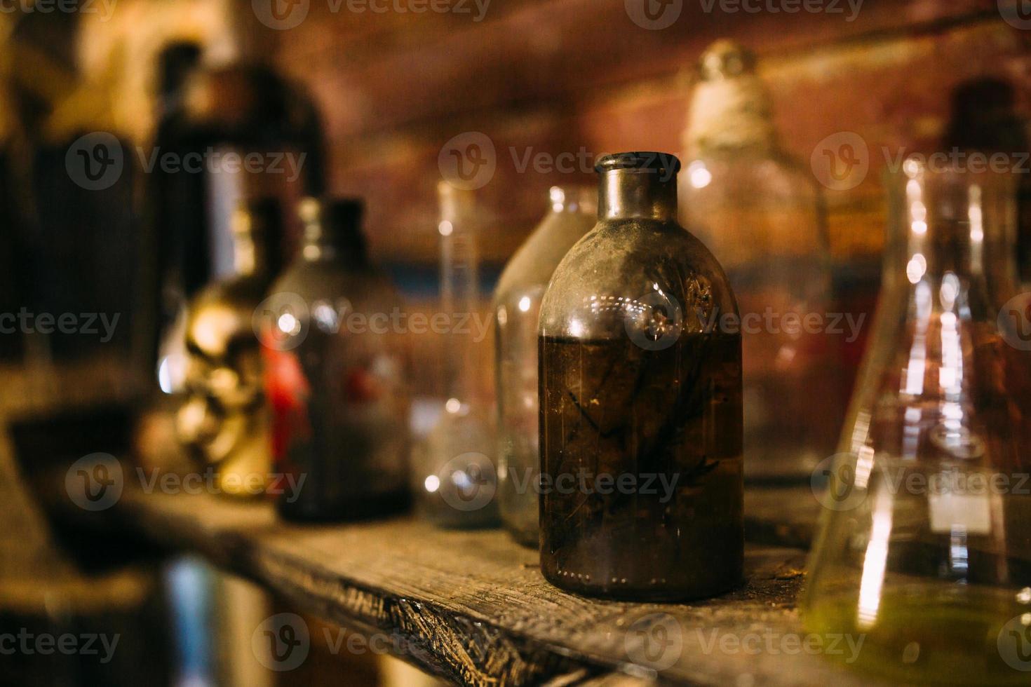 Antique medical bottle. Dark mystery halloween concept photo