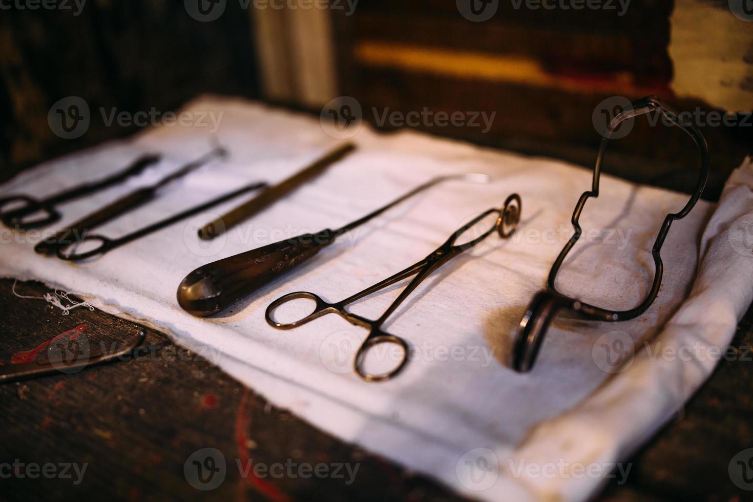 Surgical instruments for medical operation on a wooden table. photo