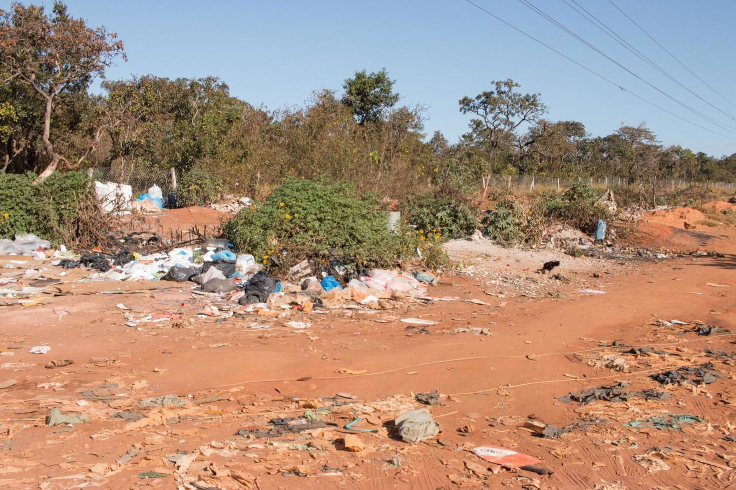 Brasilia, Brazil, June 20, 2022 Trash mostly cardboard and plastic bottles that homeless people pick up and dump out where the live in the Northwest sector of Brasilia photo