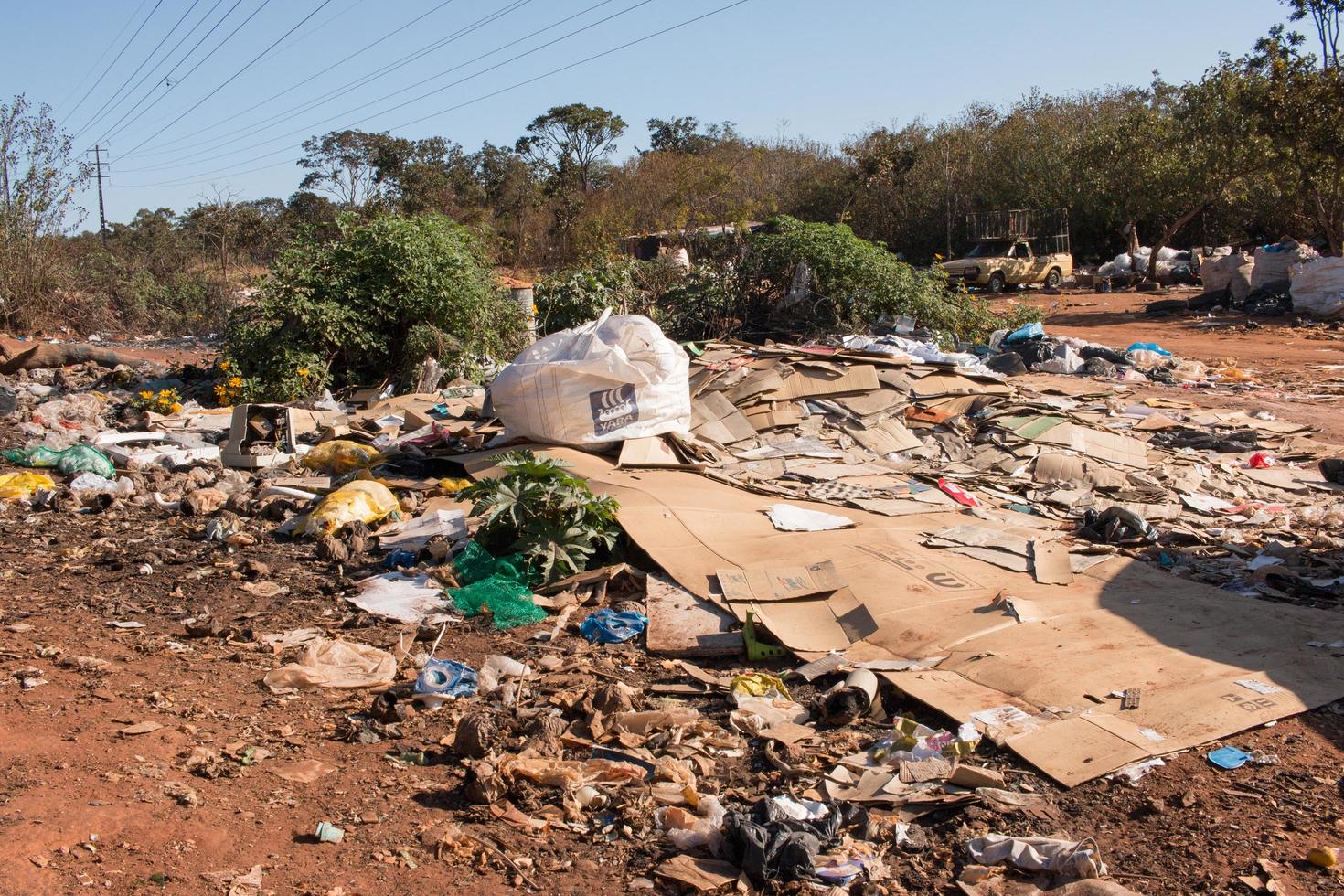 Brasilia, Brazil, June 20, 2022 Trash mostly cardboard and plastic bottles that homeless people pick up and dump out where the live in the Northwest sector of Brasilia photo