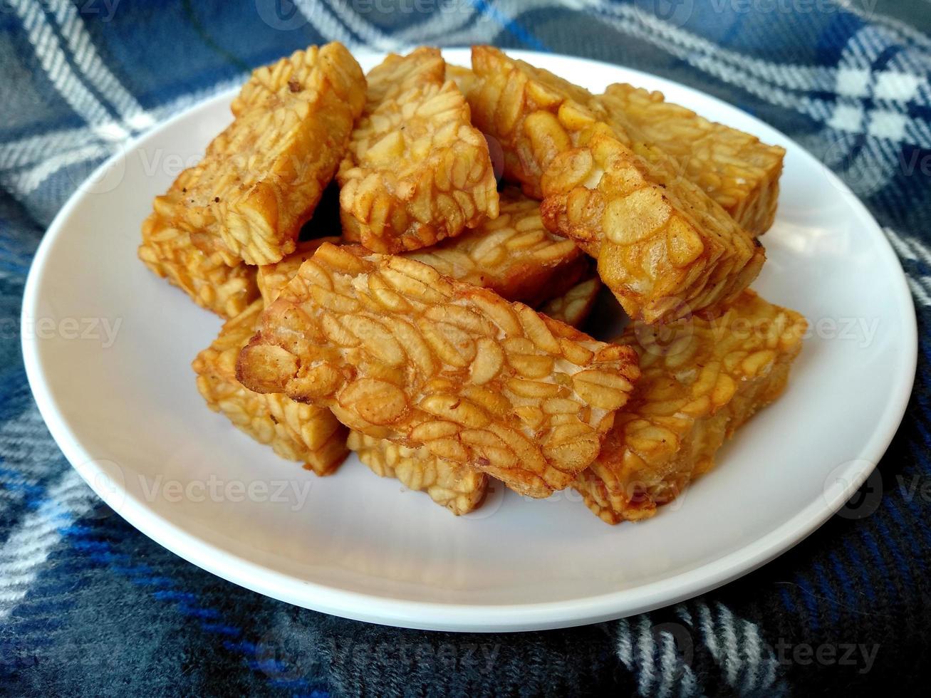 Tempe goreng or Fried Tempeh on a plate. Indonesian culinary food