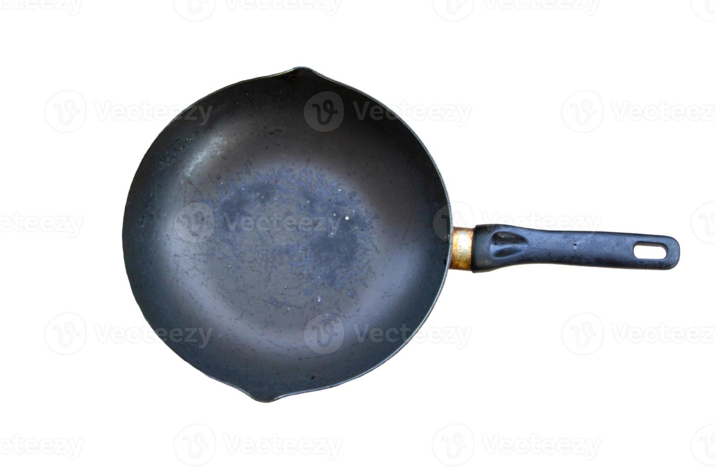 old black pan There are yellow stains on the handle. isolated on a white background photo