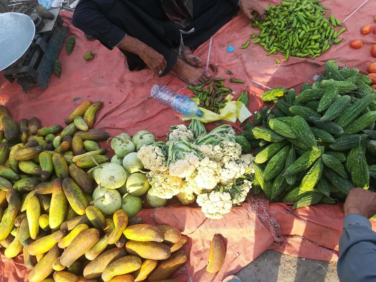 Indian male vegetable seller selling fresh vegetables photo