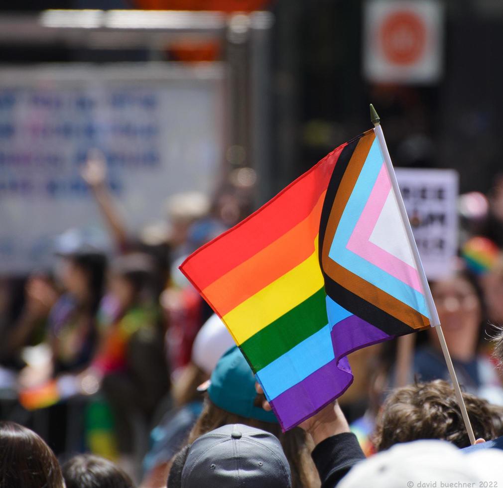 San Francisco, CA, USA - June 22, 2022, Pride Parade, parade members carrying pride flags photo