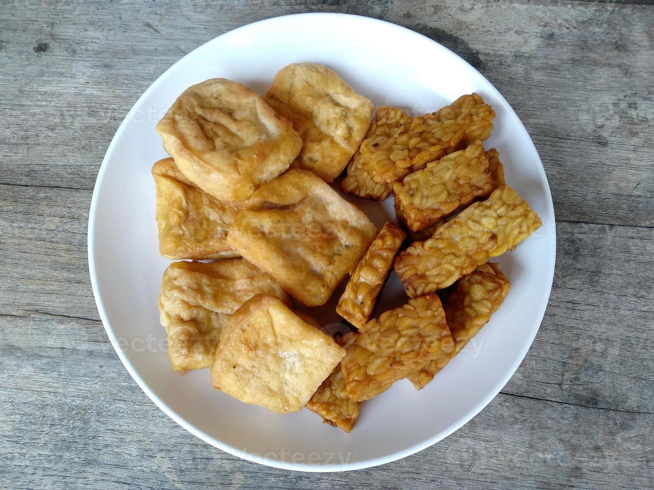 Tempe dan tahu goreng or Fried Tempehand Tofu on a plate. Indonesian culinary food photo