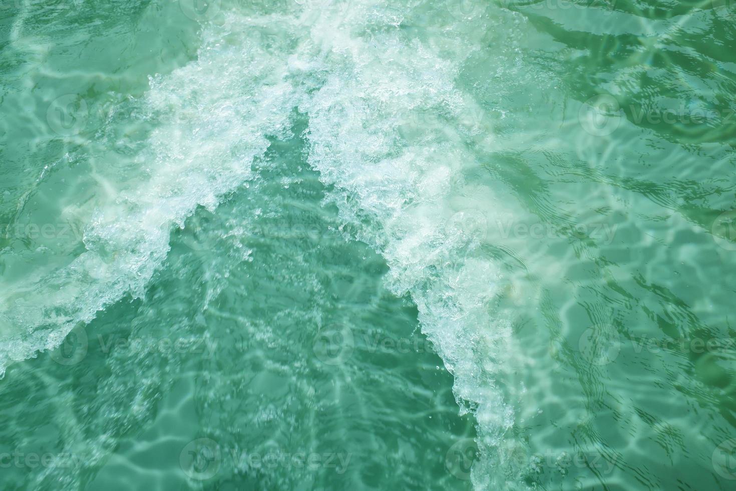 Defocus blurred blue watercolor in swimming pool rippled water detail background. Water splash, water spray background. photo