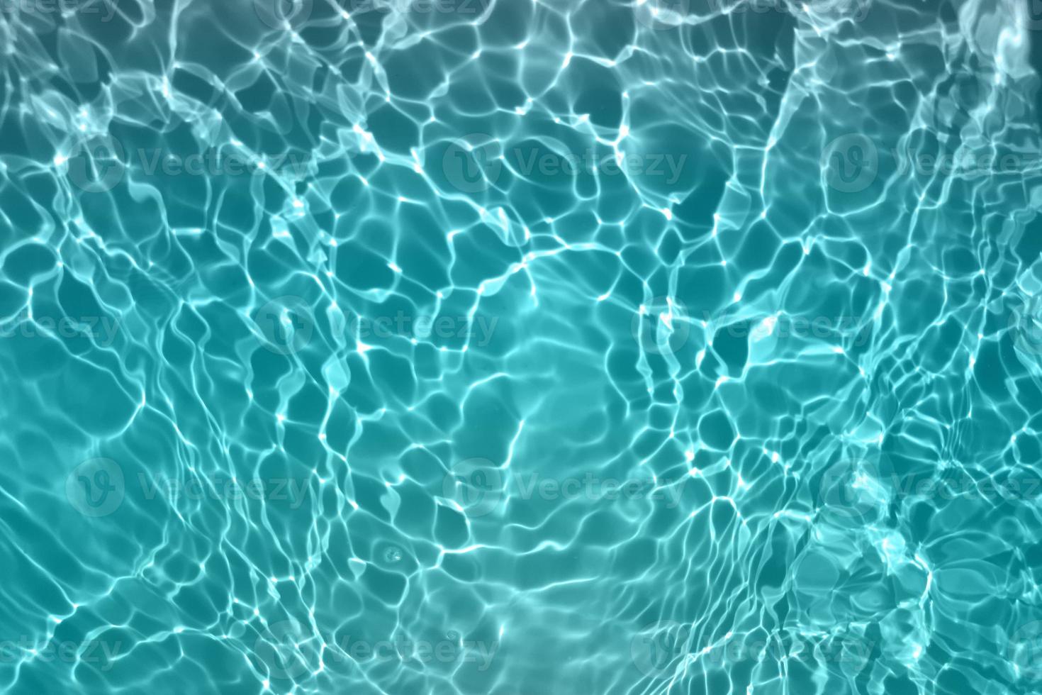 Defocus blurred blue watercolor in swimming pool rippled water detail background. Water splash, water spray background. photo