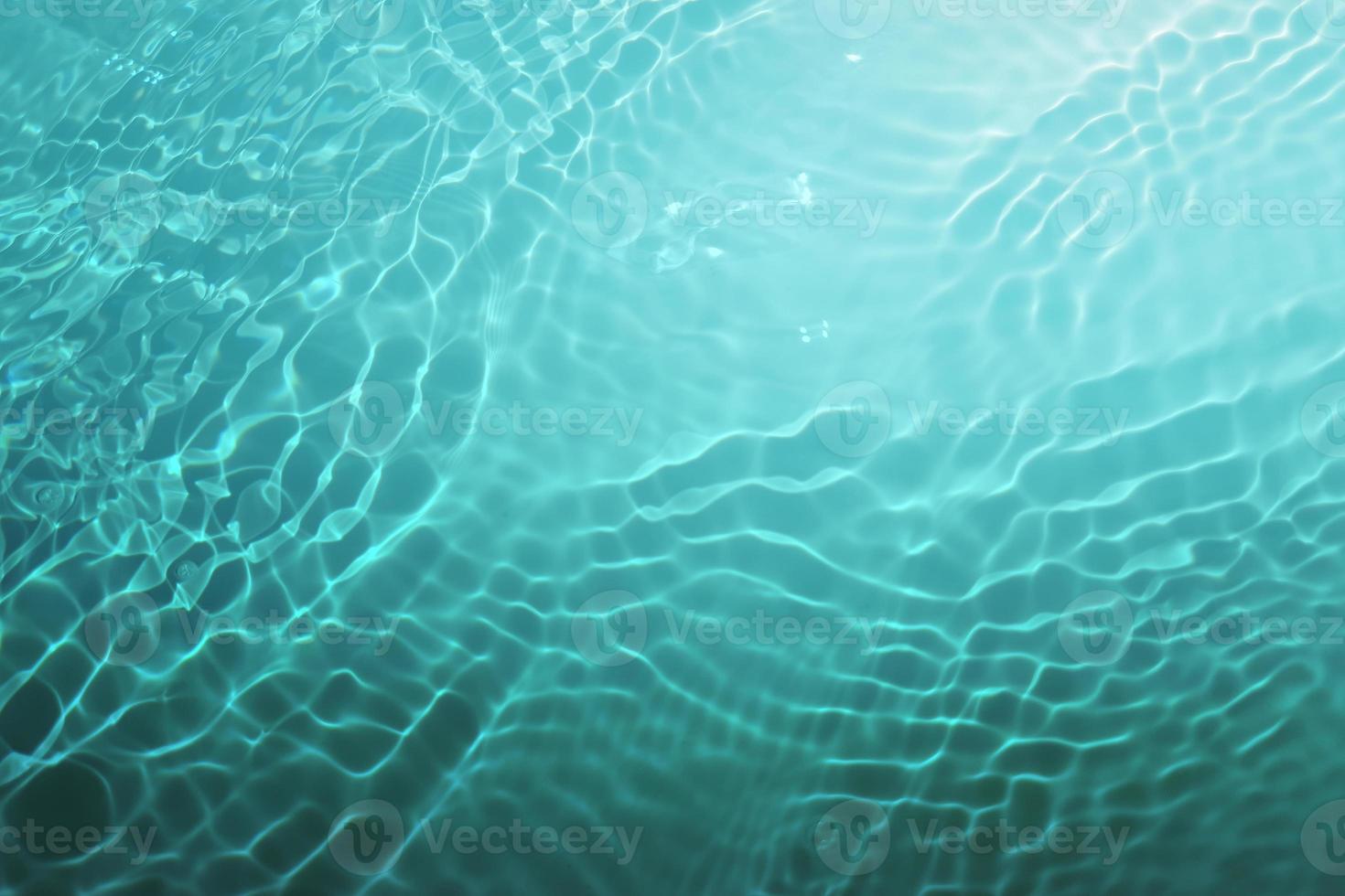 Defocus blurred blue watercolor in swimming pool rippled water detail background. Water splash, water spray background. photo