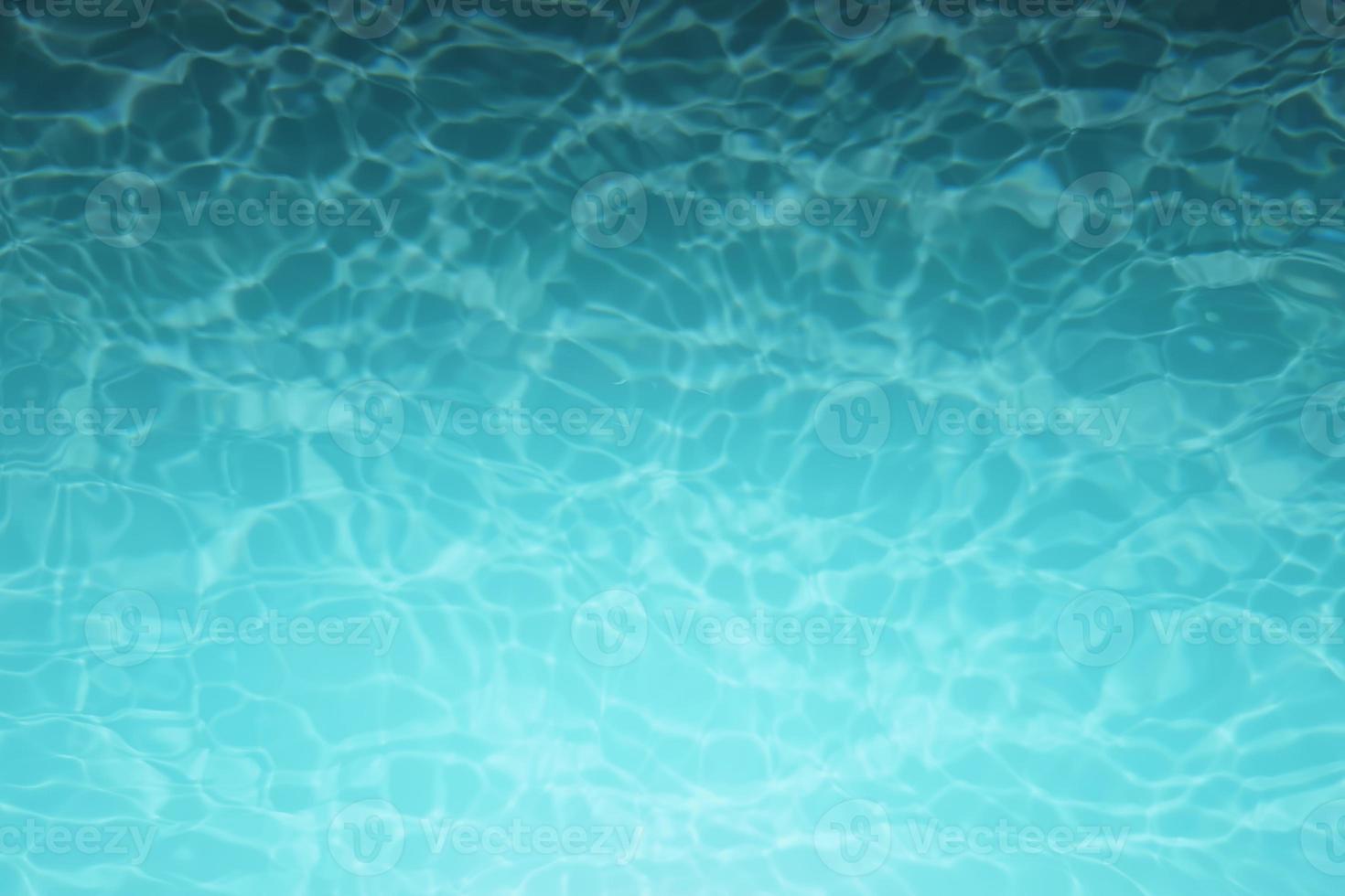 Defocus blurred blue watercolor in swimming pool rippled water detail background. Water splash, water spray background. photo