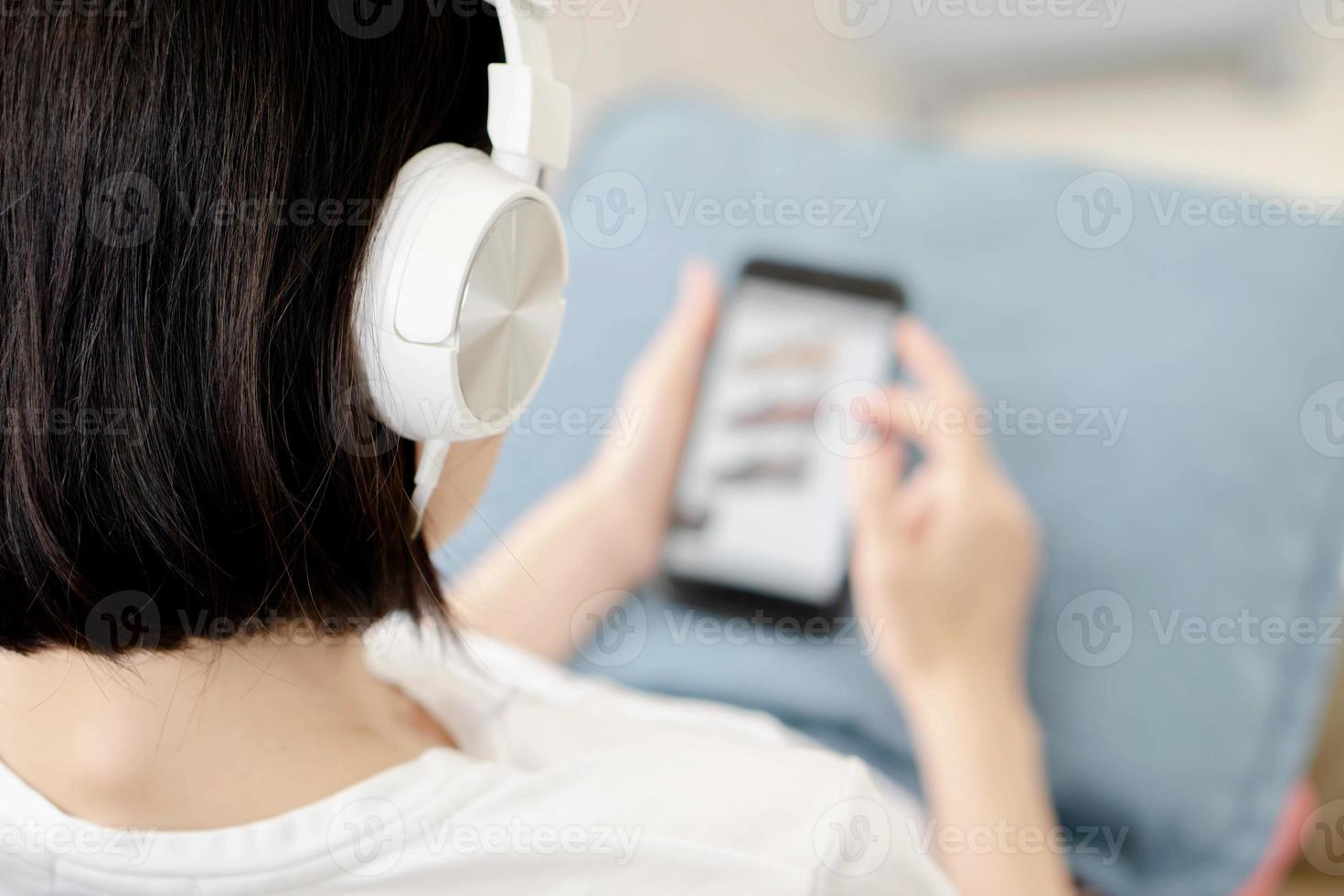 A portrait of a young teenage girl with headphones photo