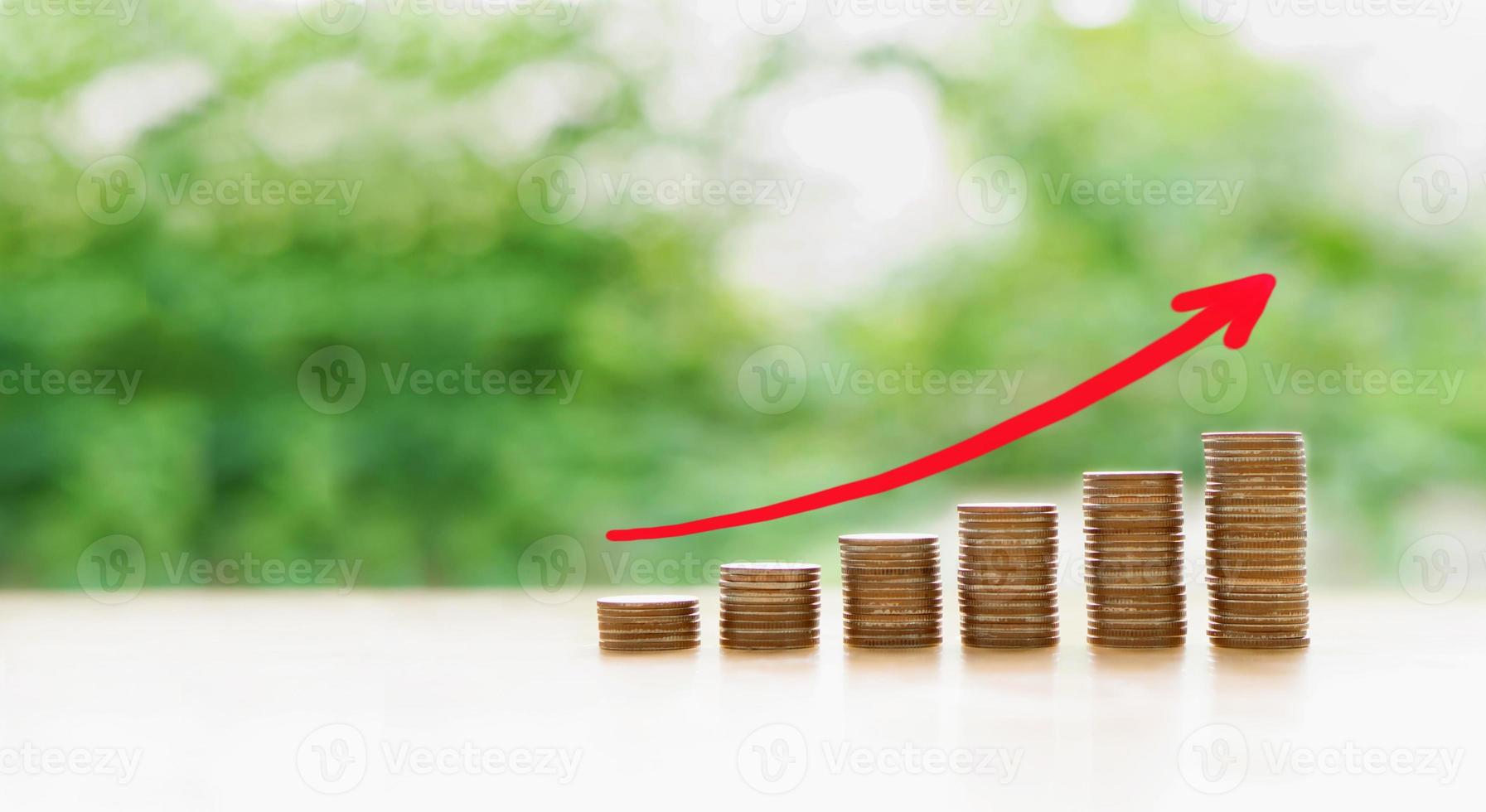 Graph from coins on green background photo