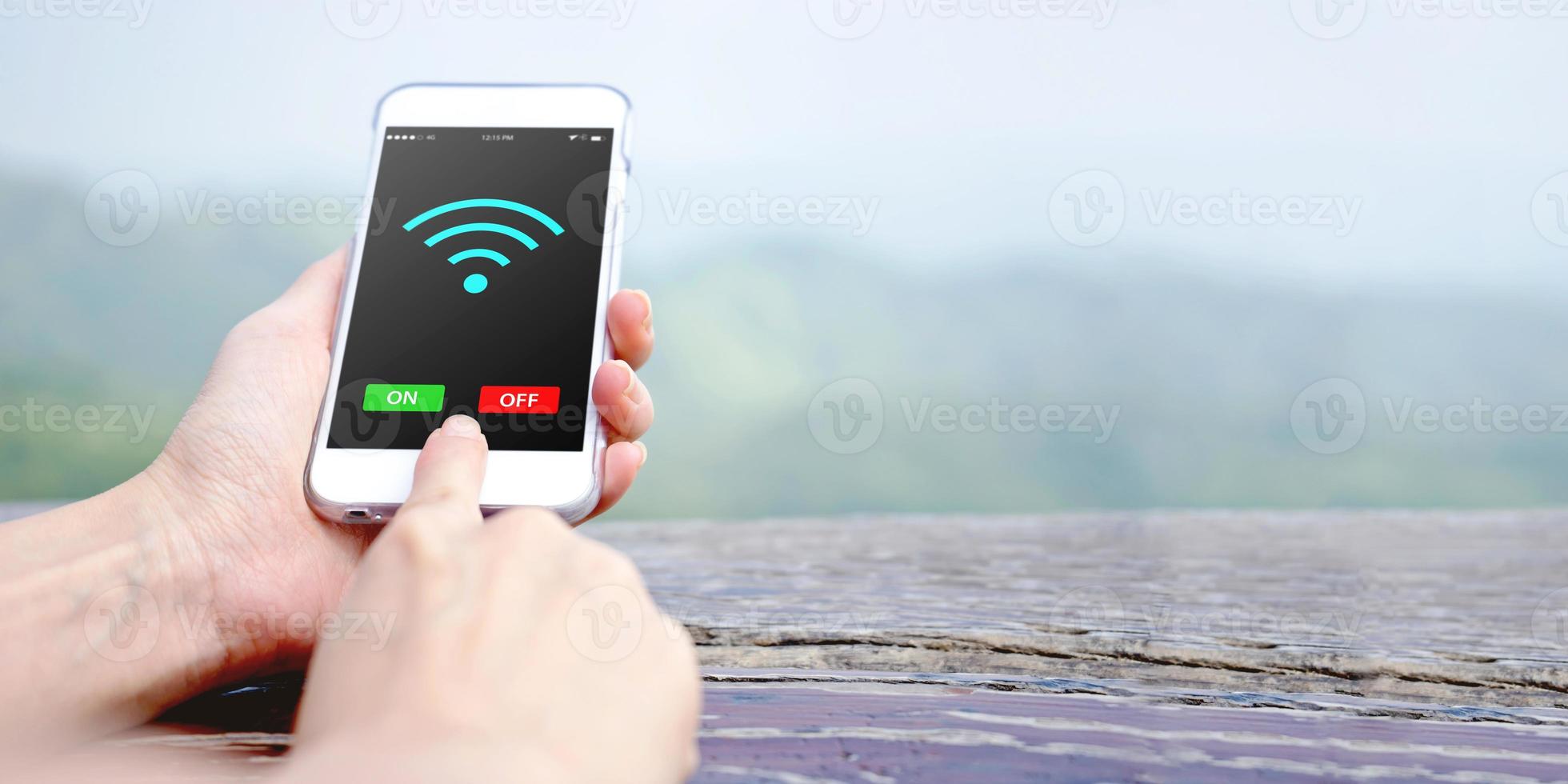 Female hand holding mobile phone with Wifi photo