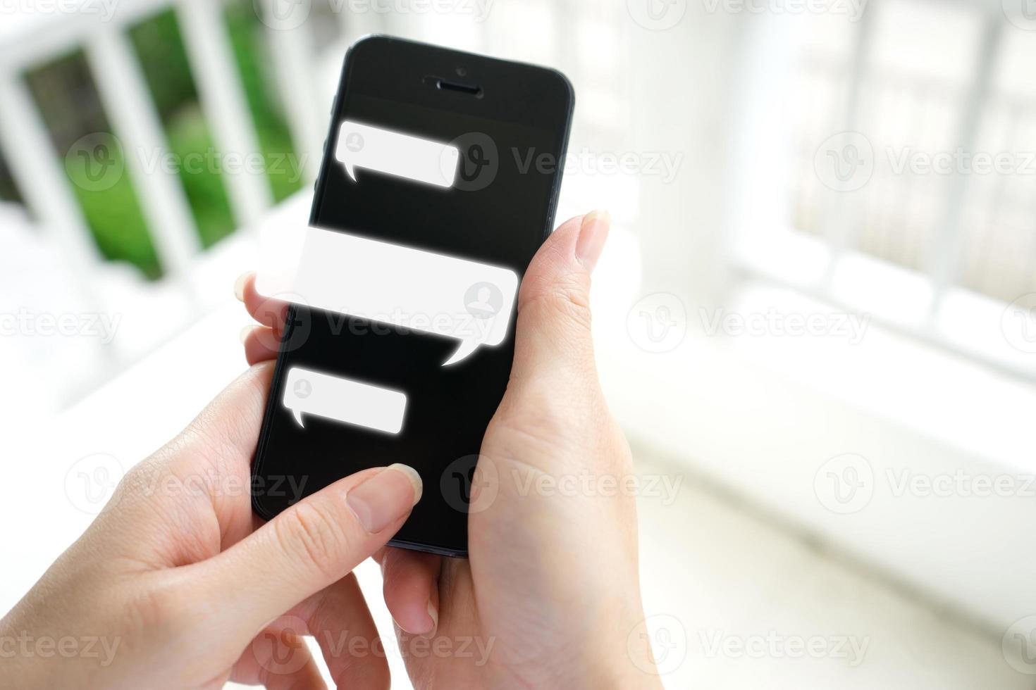 Hand of woman typing text on mobile smartphone. Online live chat chatting on application photo